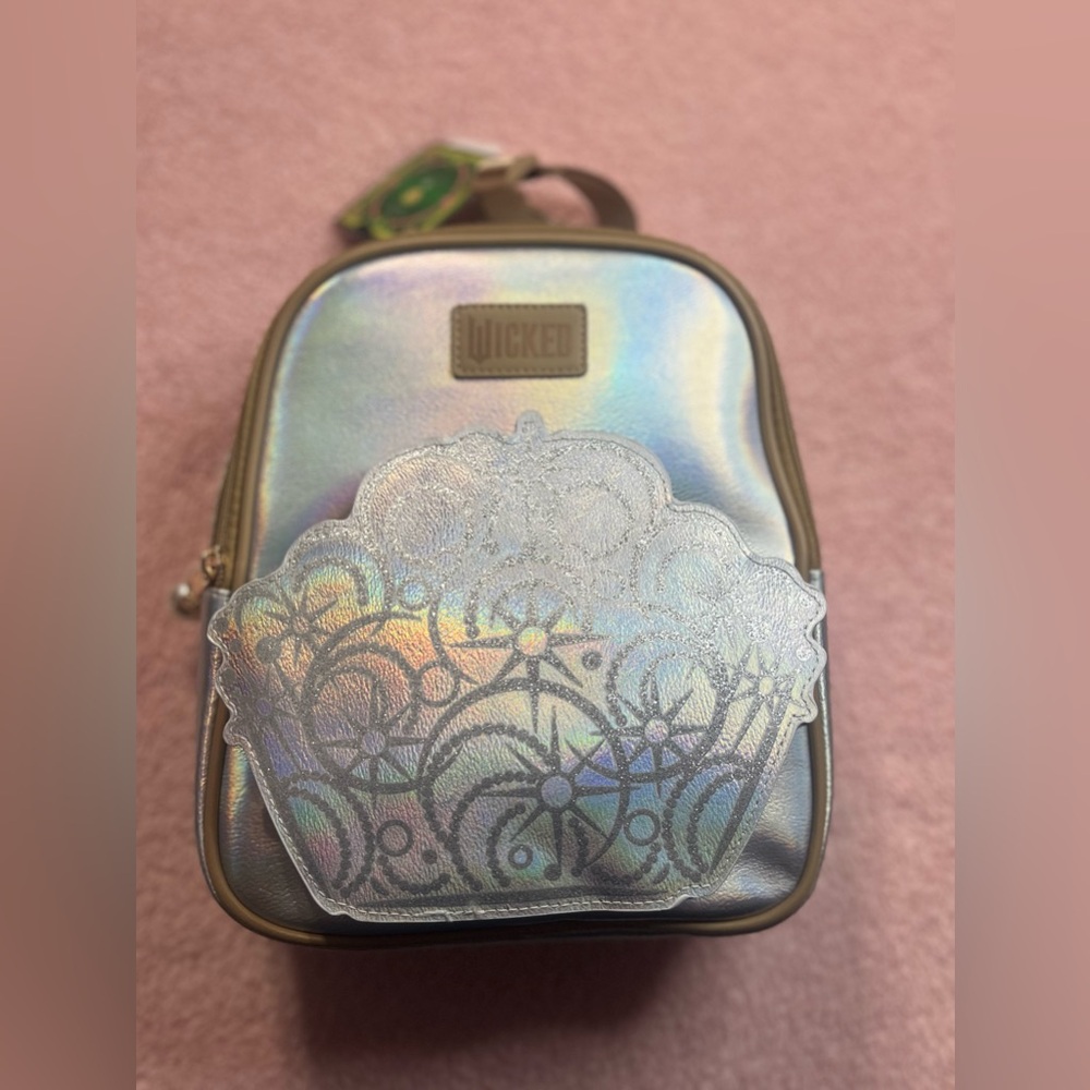 Glinda Wicked 3D Style Iridescent Crown Silver W/ Brown Trim Backpack NWT 8x10”